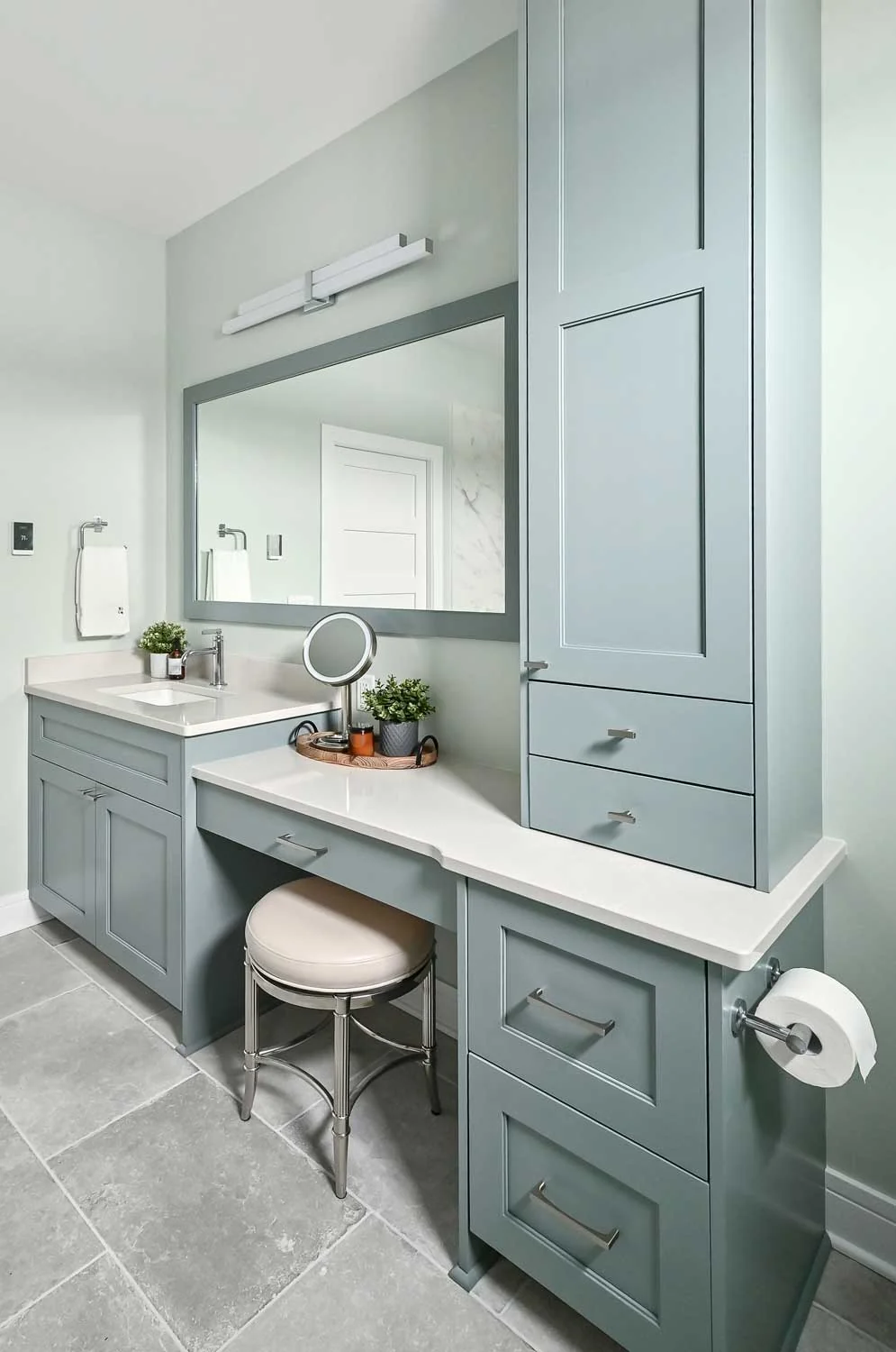 Custom bathroom vanity cabinetry with a built-in makeup counter